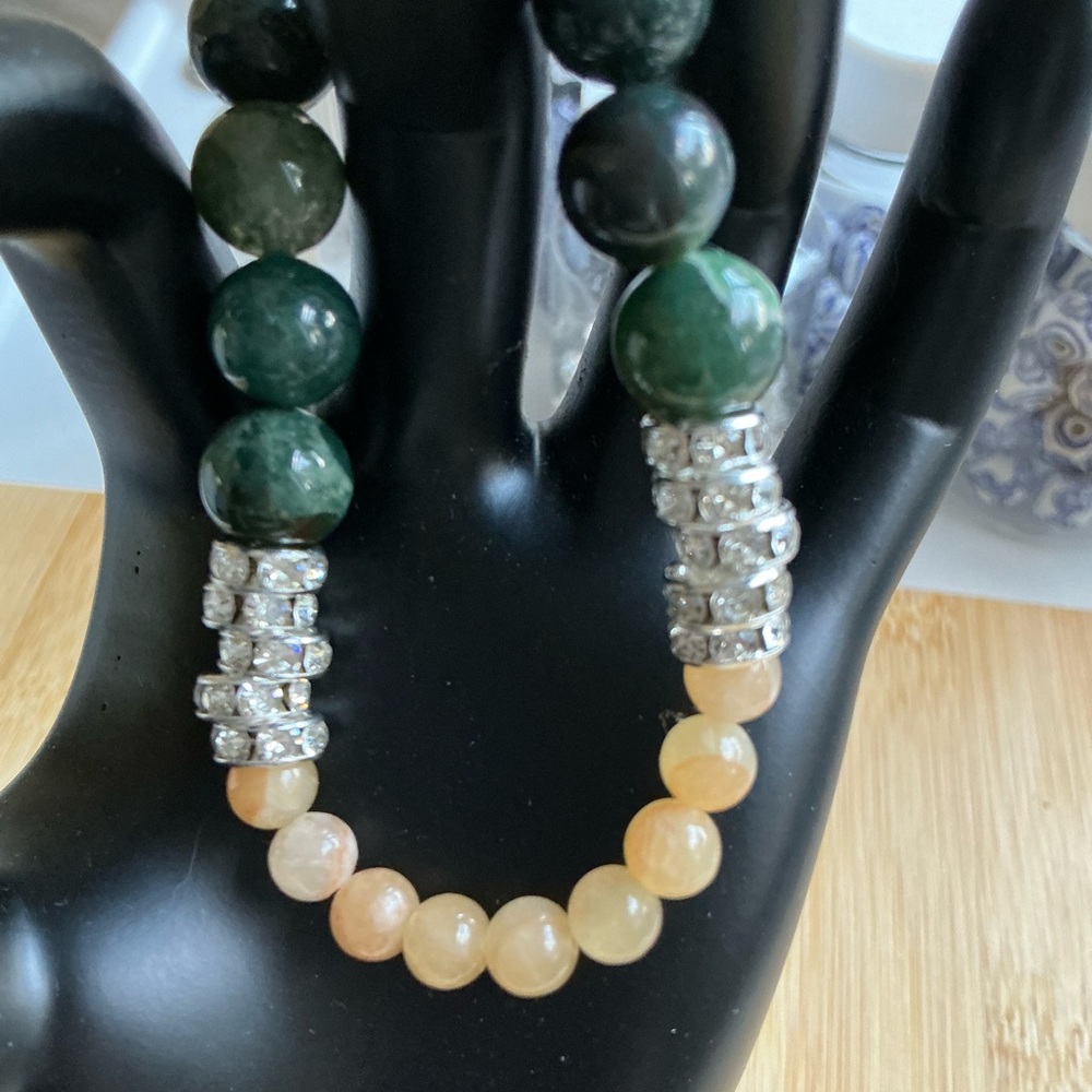 One of a kind yellow jade and subtle teal artisan crafted bead bracelet.